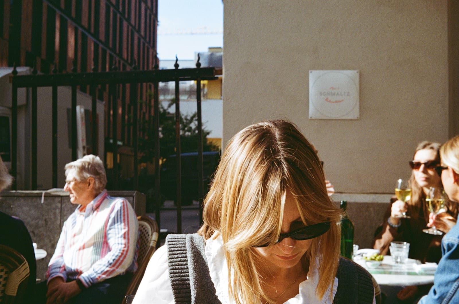 Someone sitting on a sunny café terrace